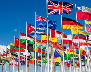 Image of various international flags blowing in the wind