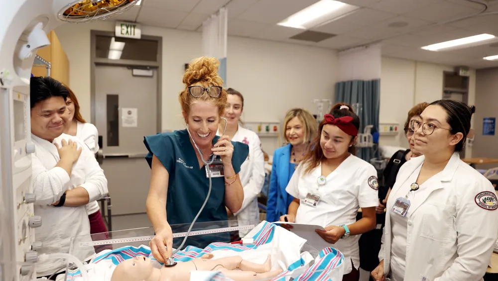 Third semester Saddleback College nursing students practicing their skills in our skills lab.