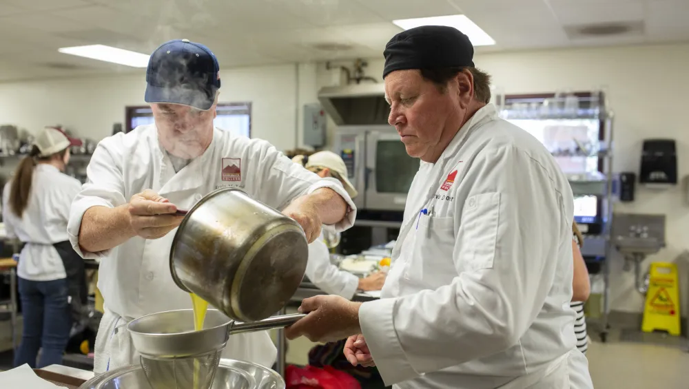 Two chefs at work in an ATEP Culinary class.