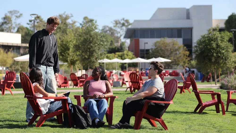 Students in conversation on the quad
