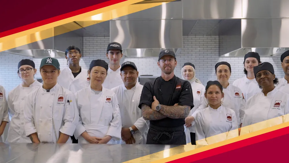 Student and teacher standing in ATEP kitchen.