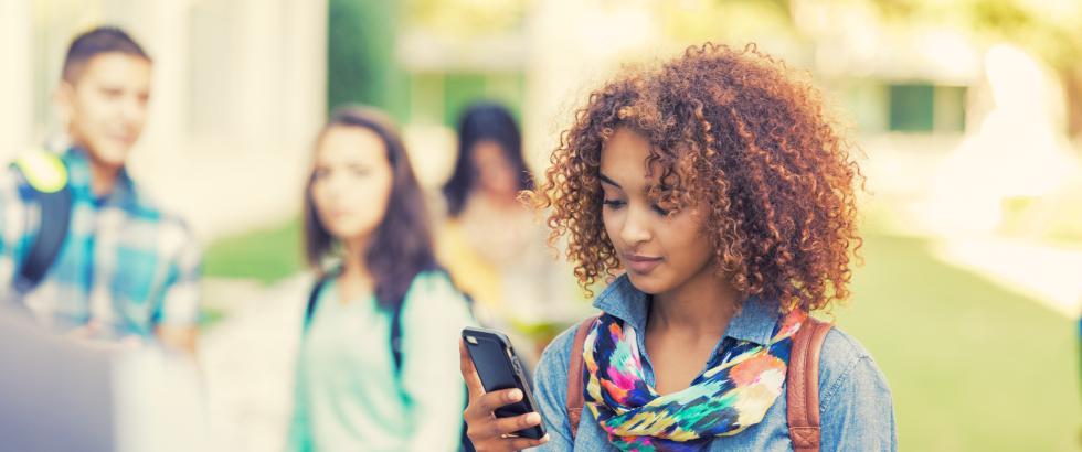 A woman looking at her phone