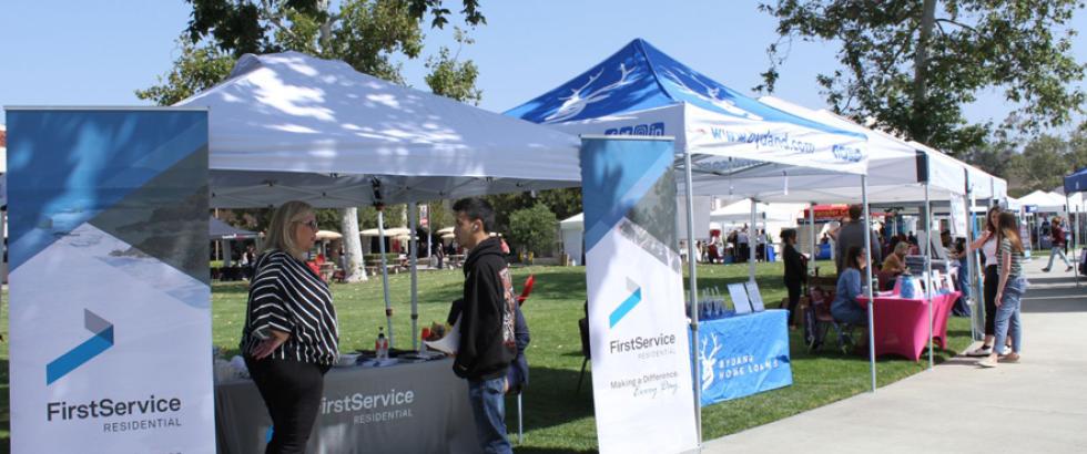 Student speaking to an employer at the Saddleback Job Fair