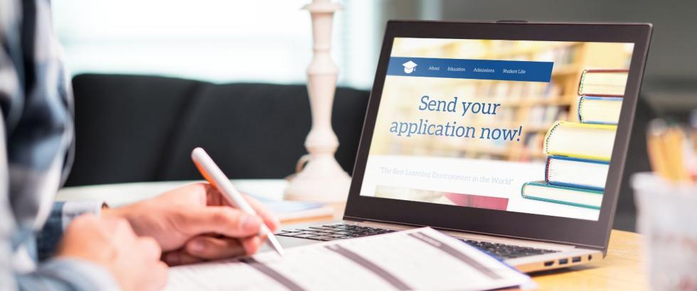 Image of an open laptop with a college application page pulled up on the screen.