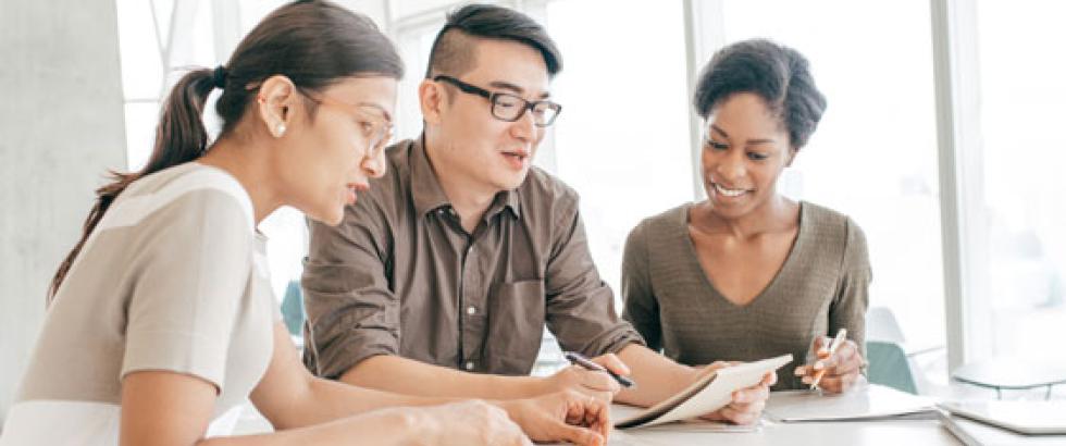 Three students working together