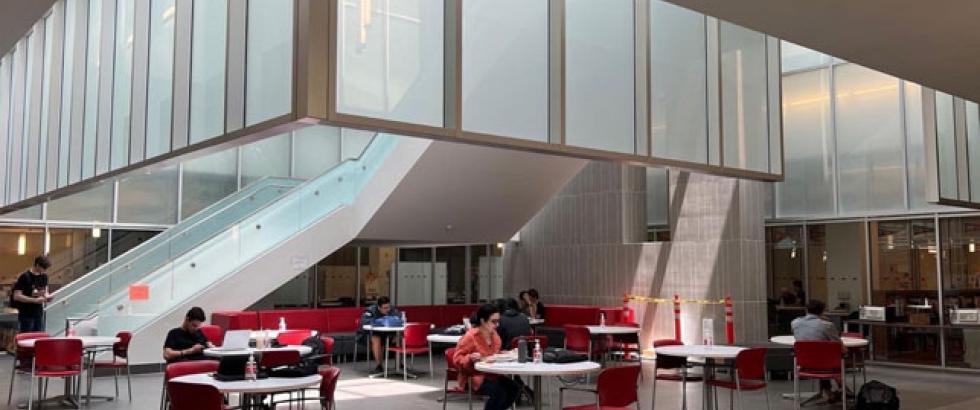 Students sitting at various tables in the Library Resource Center (LRC)