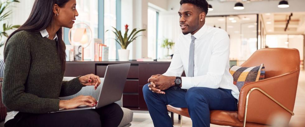 Female hiring manager interviewing male applicant