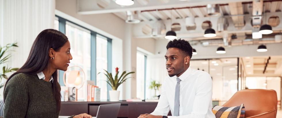 Female hiring manager interviewing male applicant