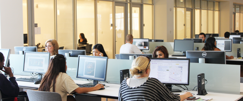 photo of students sitting at computers