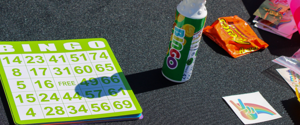 photo of bingo card, bingo marker, candy, and stickers