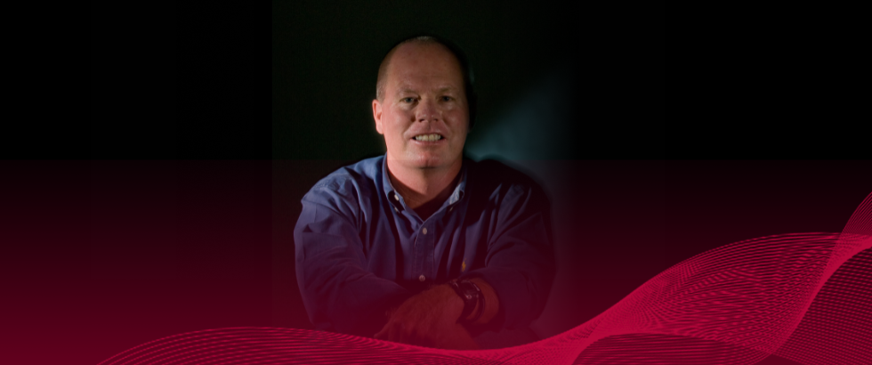 photo of Dr. Peter Ditto on a black background, with red graphics in front