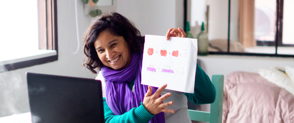 female in front of a computer teaching online