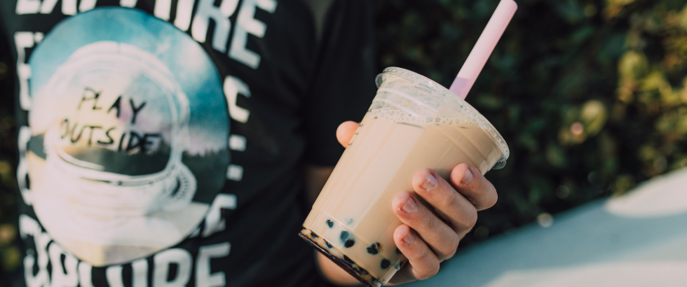 person holding a boba tea
