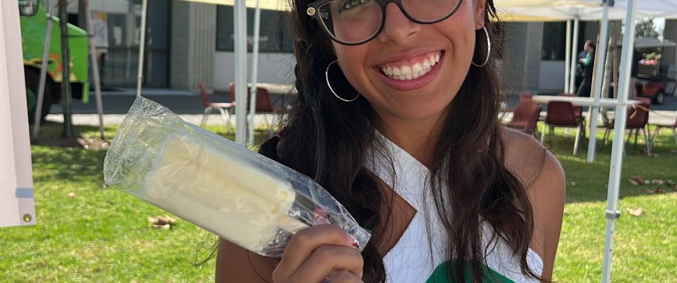 Student holding popsicle