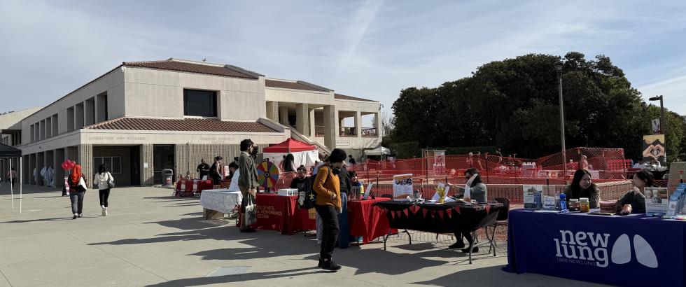 tables set up side by side featuring campus student clubs and student support offices