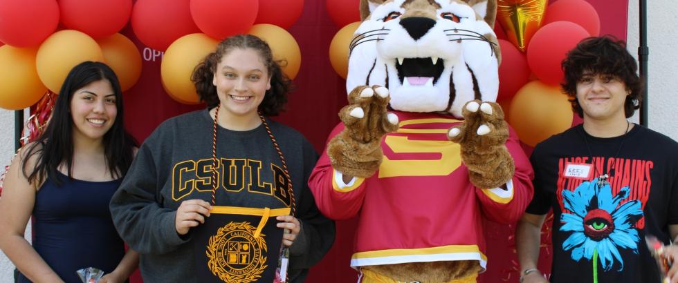 three students transferring to CSULB with Blaze, the Saddleback College mascot