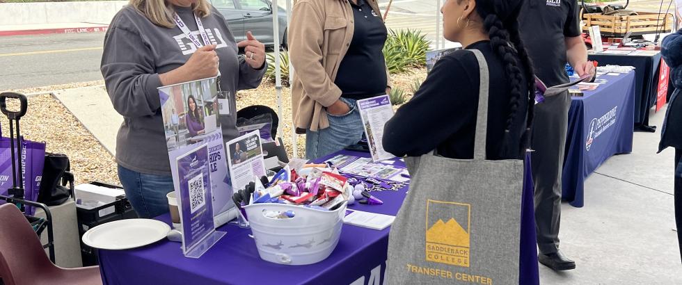 Student speaking to a Grand Canyon University representative