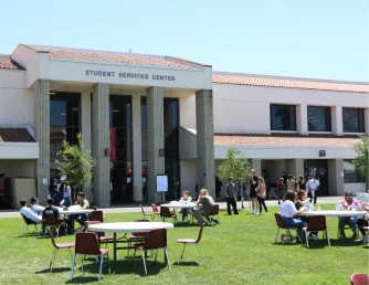 Students enjoying lunch on the quad outside the College Center building