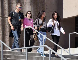 Getting Started - Saddleback College students walking down stairs outside