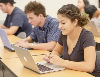 Students in class at laptops