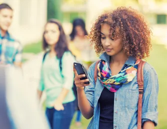 A woman looking at her phone