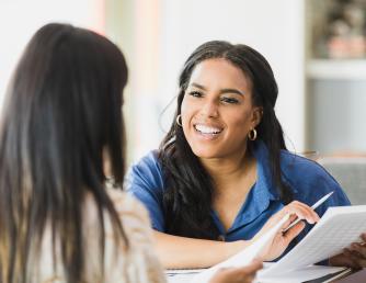 A counselor assisting a student with support services