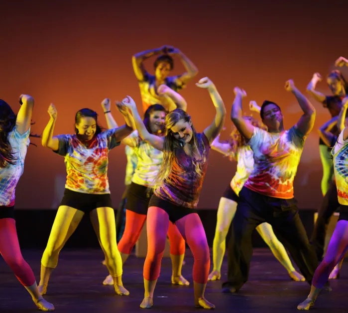 Dancers dancing on stage.