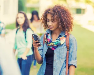 A woman looking at her phone