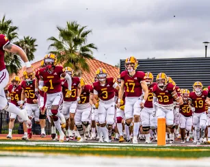 Saddleback Football Players Running onto field before the game