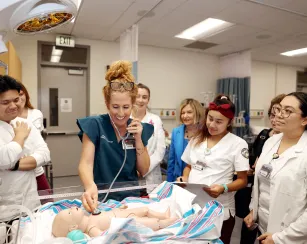 Third semester Saddleback College nursing students practicing their skills in our skills lab.