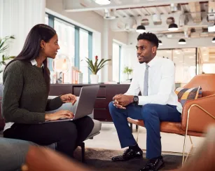 Female hiring manager interviewing male applicant