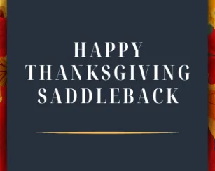 the words happy thanksgiving saddleback on a dark grey background with leaves