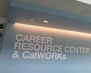 photo of a wall with the words Career Resource Center & CalWorks