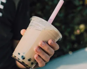 person holding a boba tea