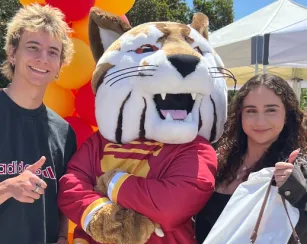 saddleback college mascot, blaze the bobcat, surrounded by students