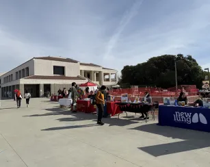 tables set up side by side featuring campus student clubs and student support offices