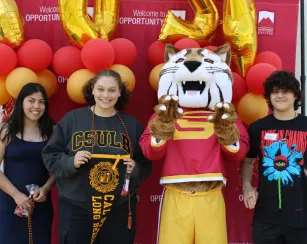 three students transferring to CSULB with Blaze, the Saddleback College mascot