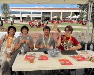 Members of the advanced manufacturing club smile at camera