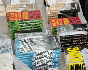 Stacks of books written about and by Martin Luther King, Jr.