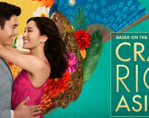 A movie poster shows a man and a woman holding each other and smiling