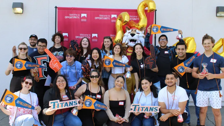A group of Saddleback College students transferring to CSUF pose together for a photo
