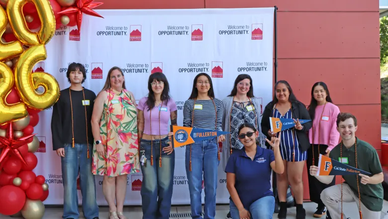 A group of students transferring to CSUF pose for a photo together during the Transfer Fair ceremony held in May 2026.