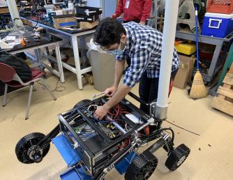 Saddleback Student working on robotic rover
