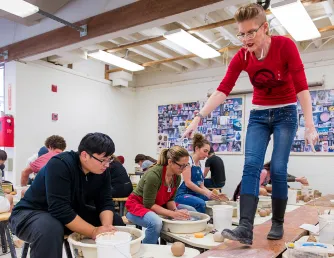 Saddleback College instructor teaching pottery class