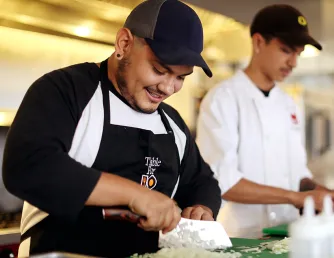 Saddleback College students meal prepping in culinary class