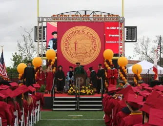 Commencement graduates listening to Dr. Stern remarks