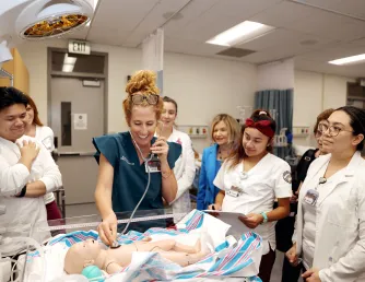 Third semester Saddleback College nursing students practicing their skills in our skills lab.