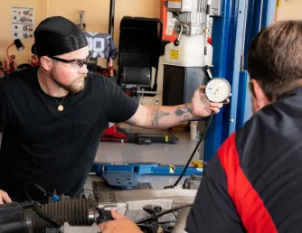Automotive student checking gauge