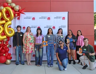 A group of students transferring to CSUF pose for a photo together during the Transfer Fair ceremony held in May 2026.