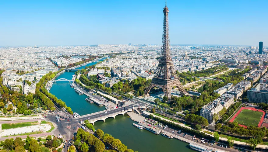 Aerial view of Paris featuring the Eifel Tower.